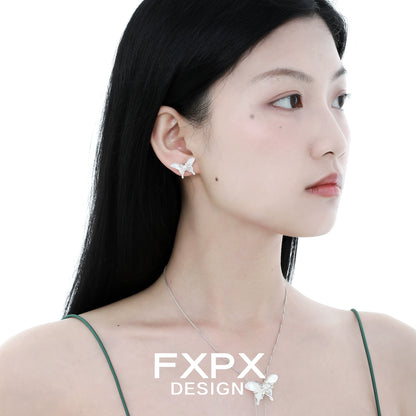 Model wearing elegant white shell butterfly earrings for a stylish and delicate look