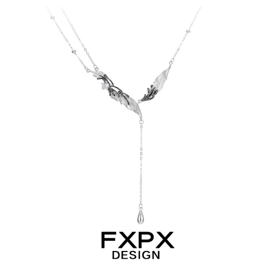 Stylish FXPX Y2K black feather necklace featuring elegant design and unique chain drop
