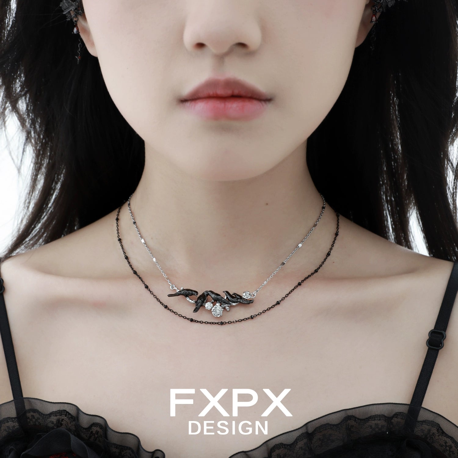 Y2K crow pendant necklace by FXPX showcased on a model with a chic outfit