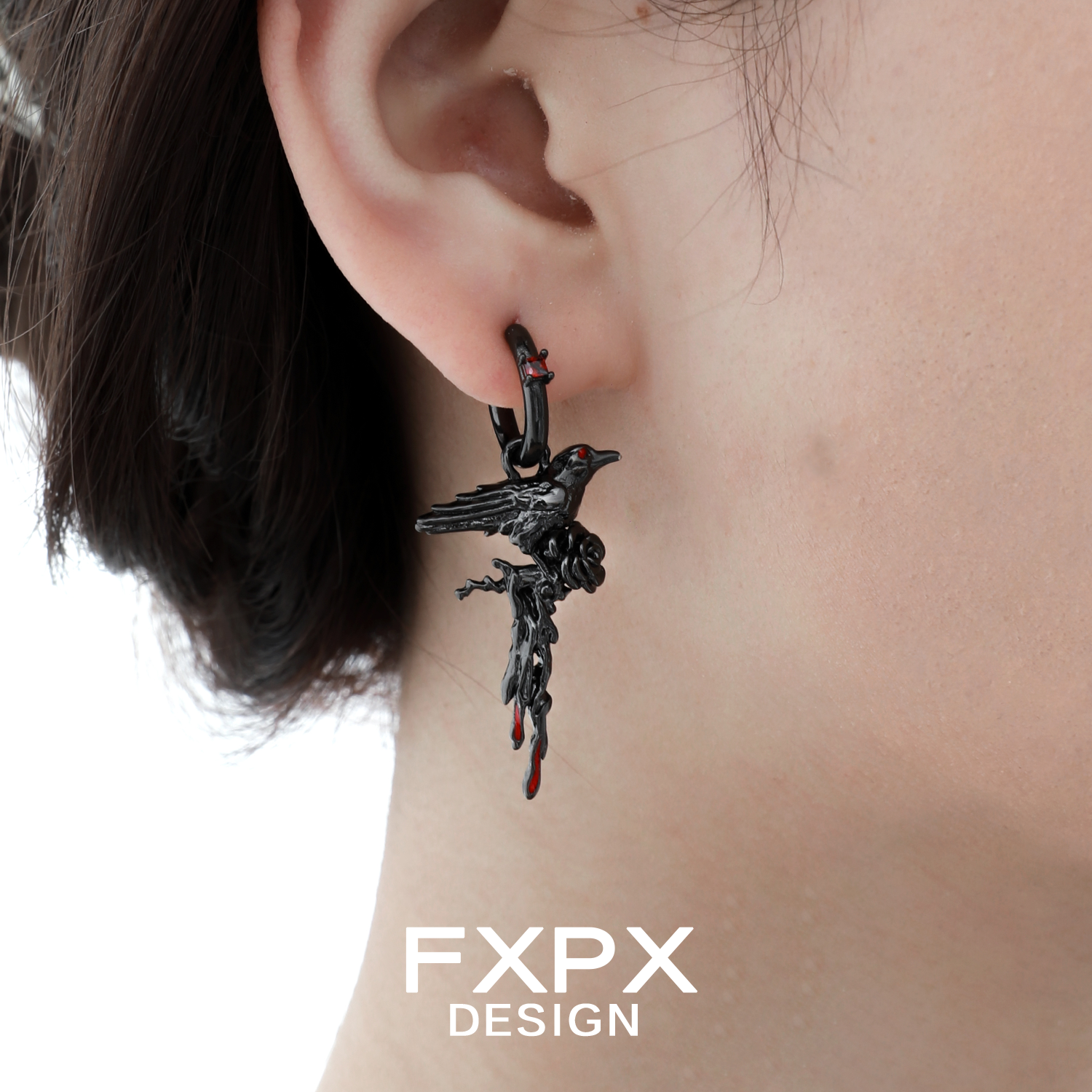 Y2K dark crow ear cuff by FXPX with intricate design and dark finishing on a model's ear