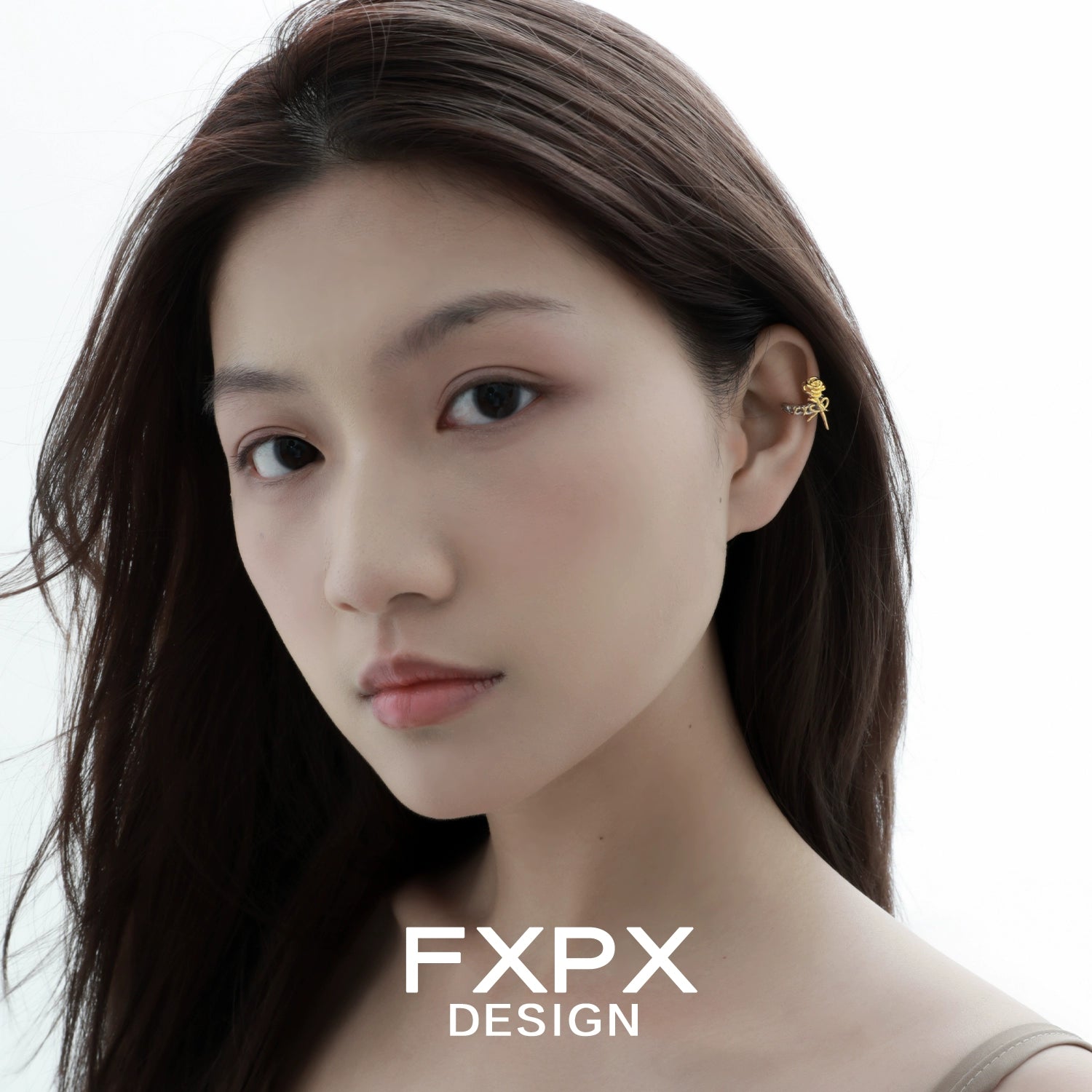 Y2K golden rose ear cuff worn by a model with long hair for a trendy look