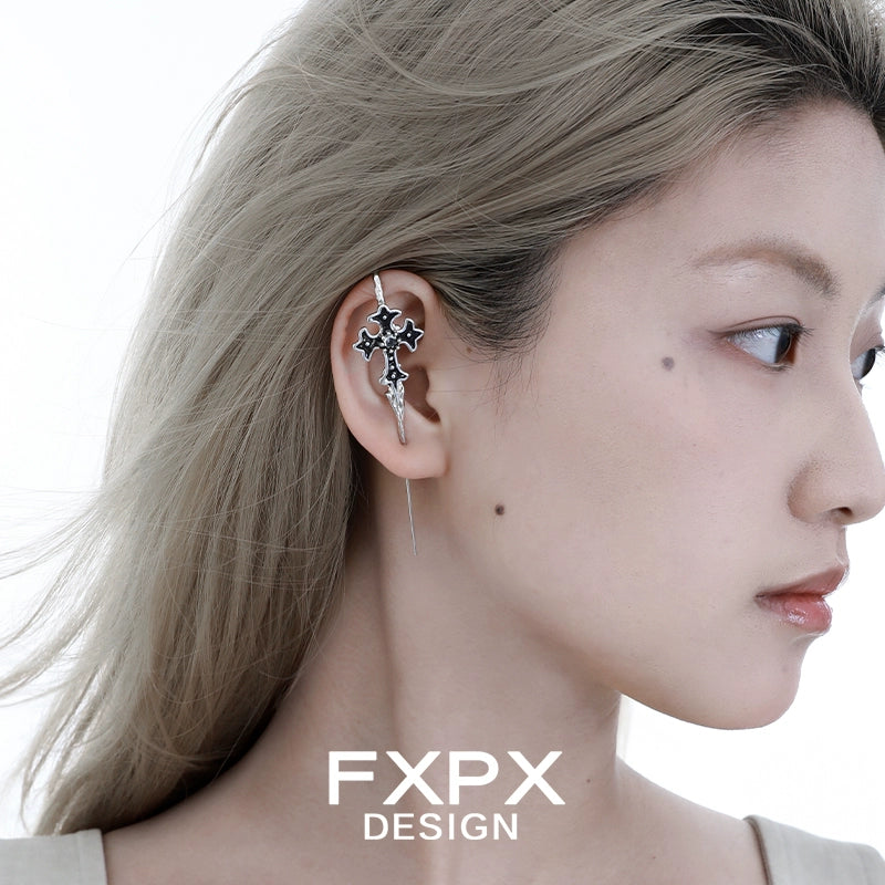 FXPX Y2K gothic cross ear needle with unique design, worn on a model's ear