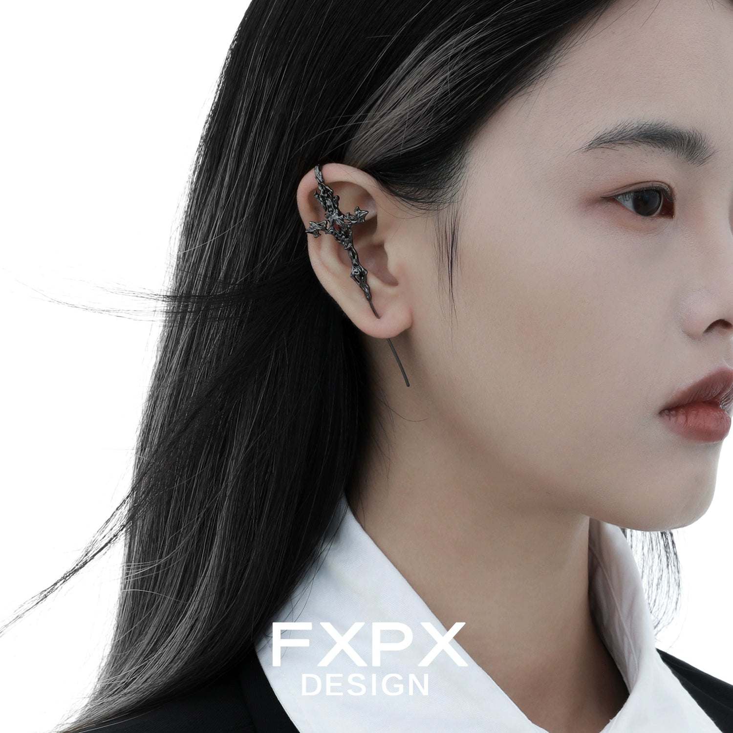 Y2K gothic cross earring designed by FXPX, showcasing a unique and stylish accessory on a model.