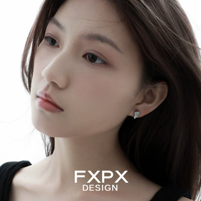 Model wearing FXPX Y2K meteor earrings, featuring a unique design and sparkling gemstones