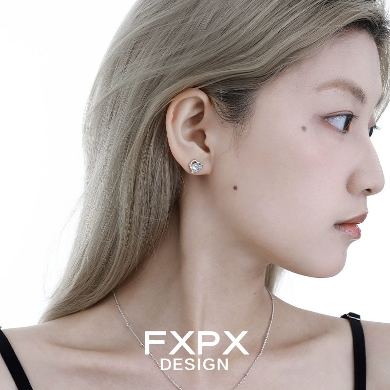 Stylish Y2K moonstone earrings showcased on model with sleek hairstyle