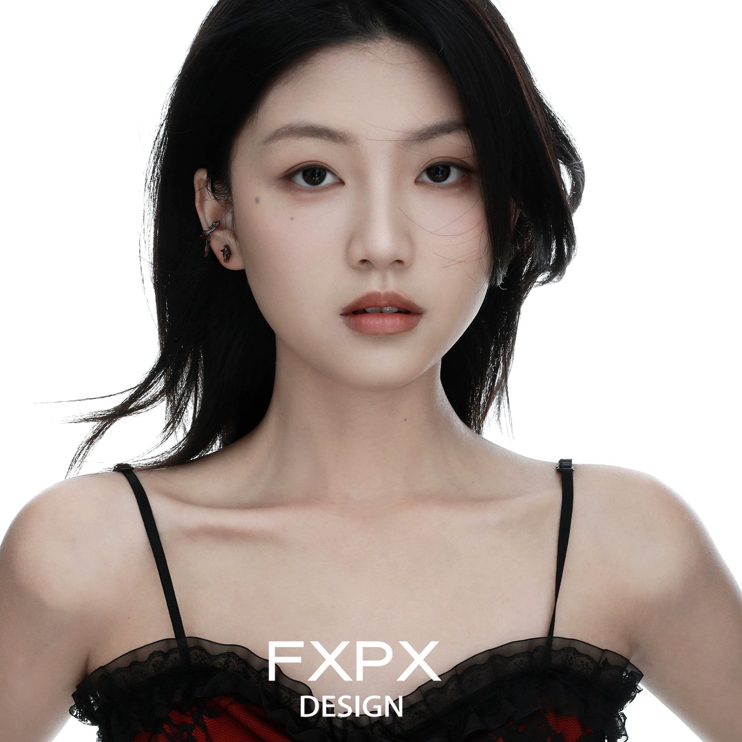 Y2K orange stud earrings showcased on a model with long dark hair in a stylish outfit