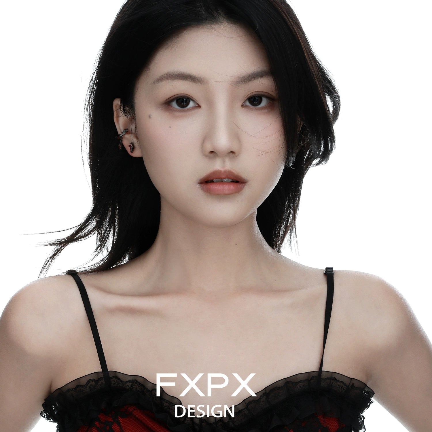 Y2K orange stud earrings showcased on a model with long dark hair in a stylish outfit