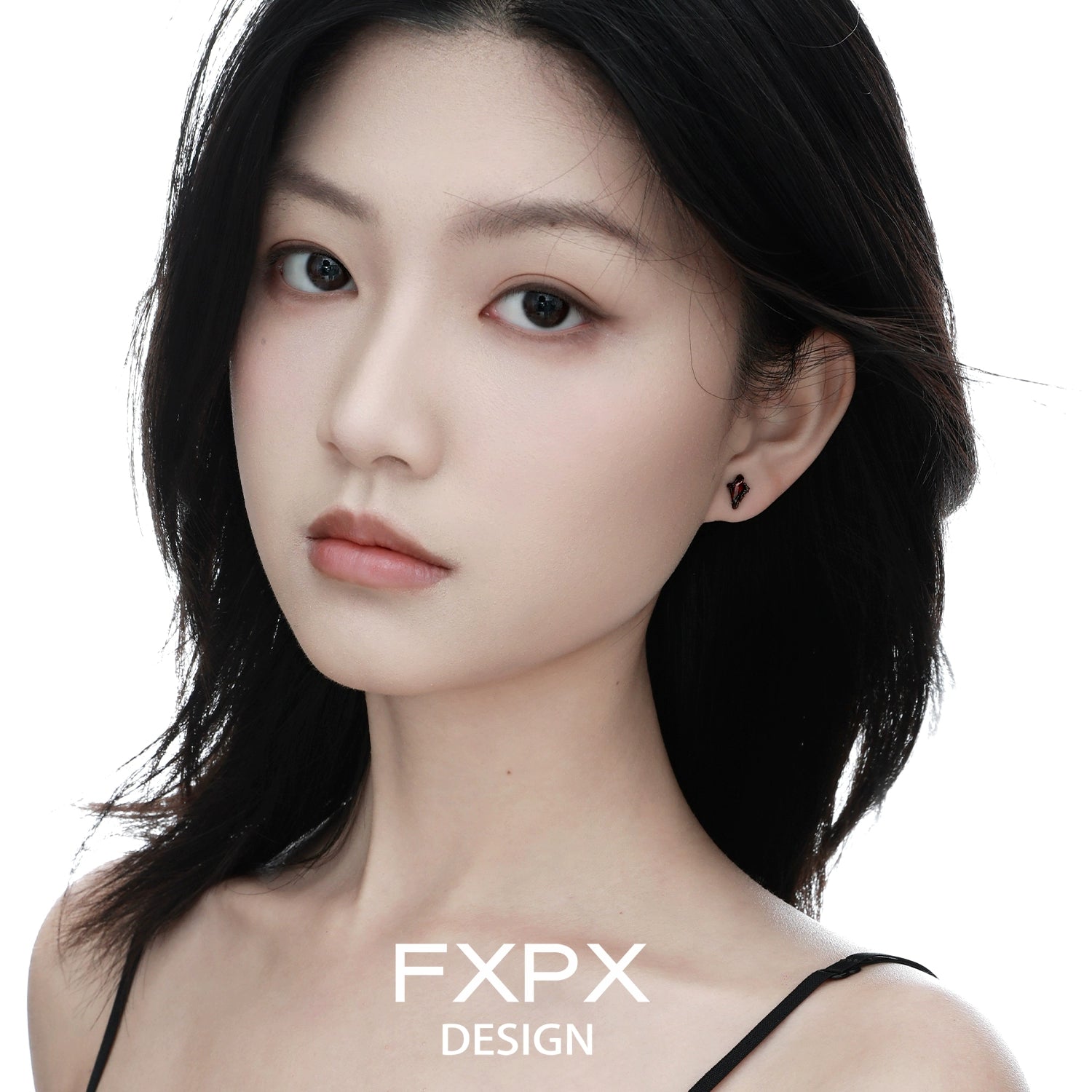 FXPX Y2K orange stud earrings showcased on a model with dark hair and a neutral background
