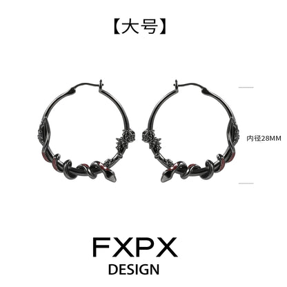 FXPX Y2K ouroboros earrings in black with intricate twisted design and hoop style