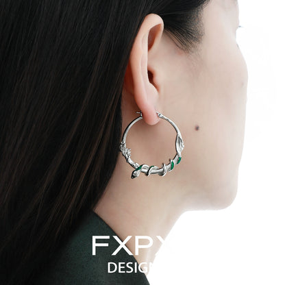 Y2K ouroboros earrings in silver with intricate design, perfect for trendy fashion lovers