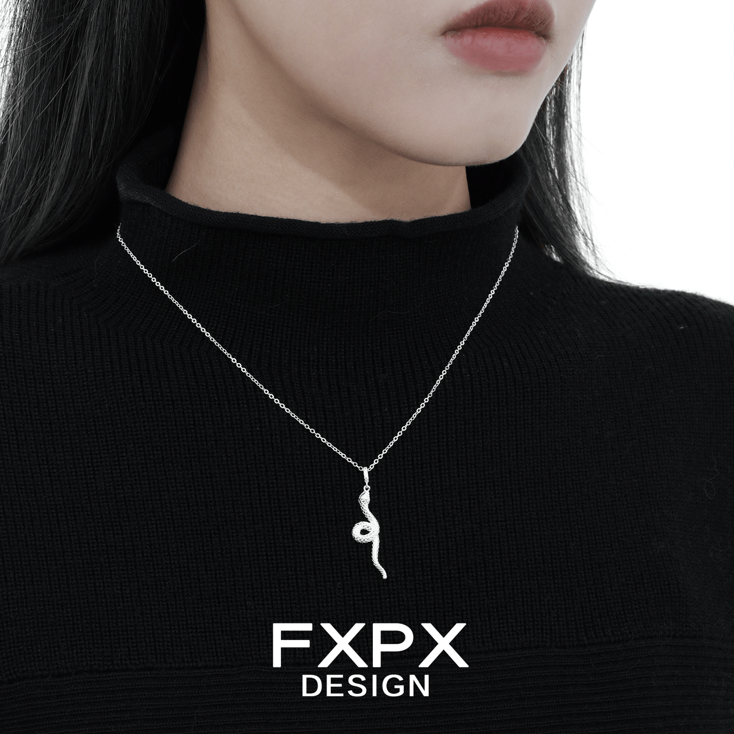 Y2K silver snake necklace elegantly worn on a model's neck with a black sweater