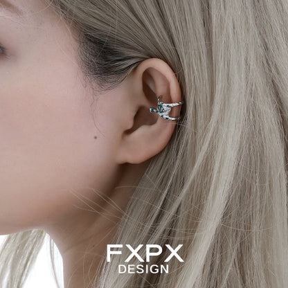 Y2K snake ear cuff stylishly displayed on a model's ear with long blonde hair