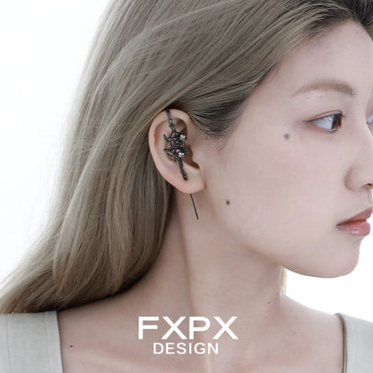 Y2K spider ear piercing jewelry with a unique design displayed on a model's ear