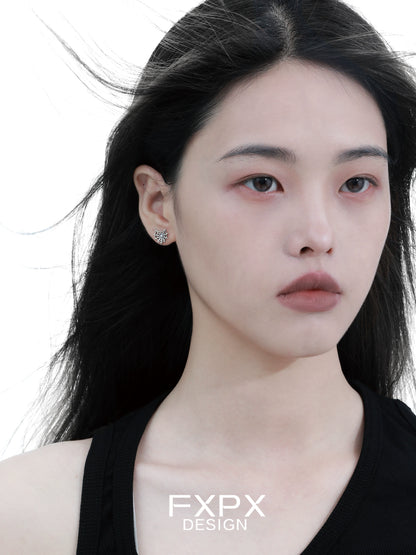 FXPX Y2K spider web earrings showcased on a model with flowing hair and a neutral expression