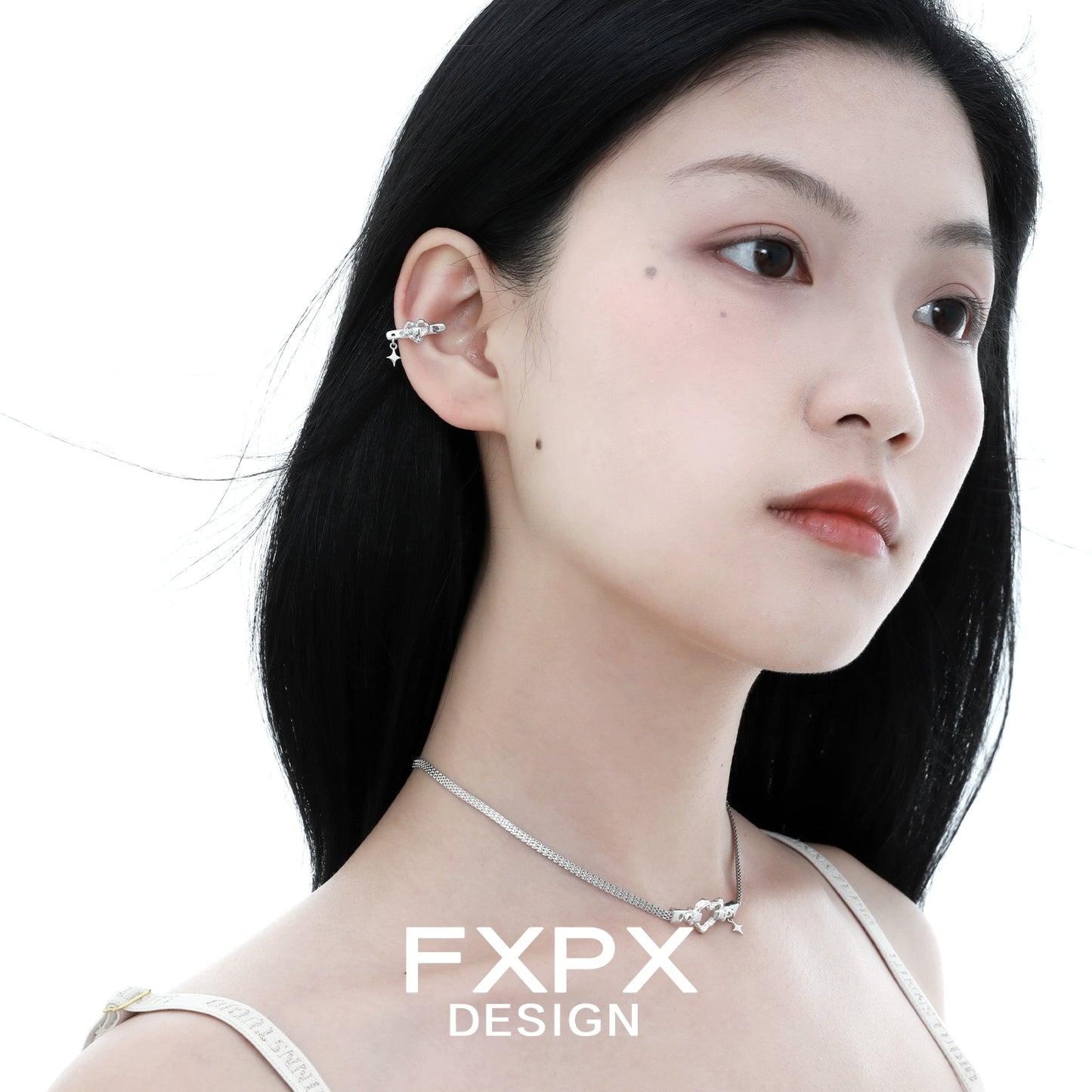 FXPX Y2K star ear cuff in silver worn by a model for a trendy look