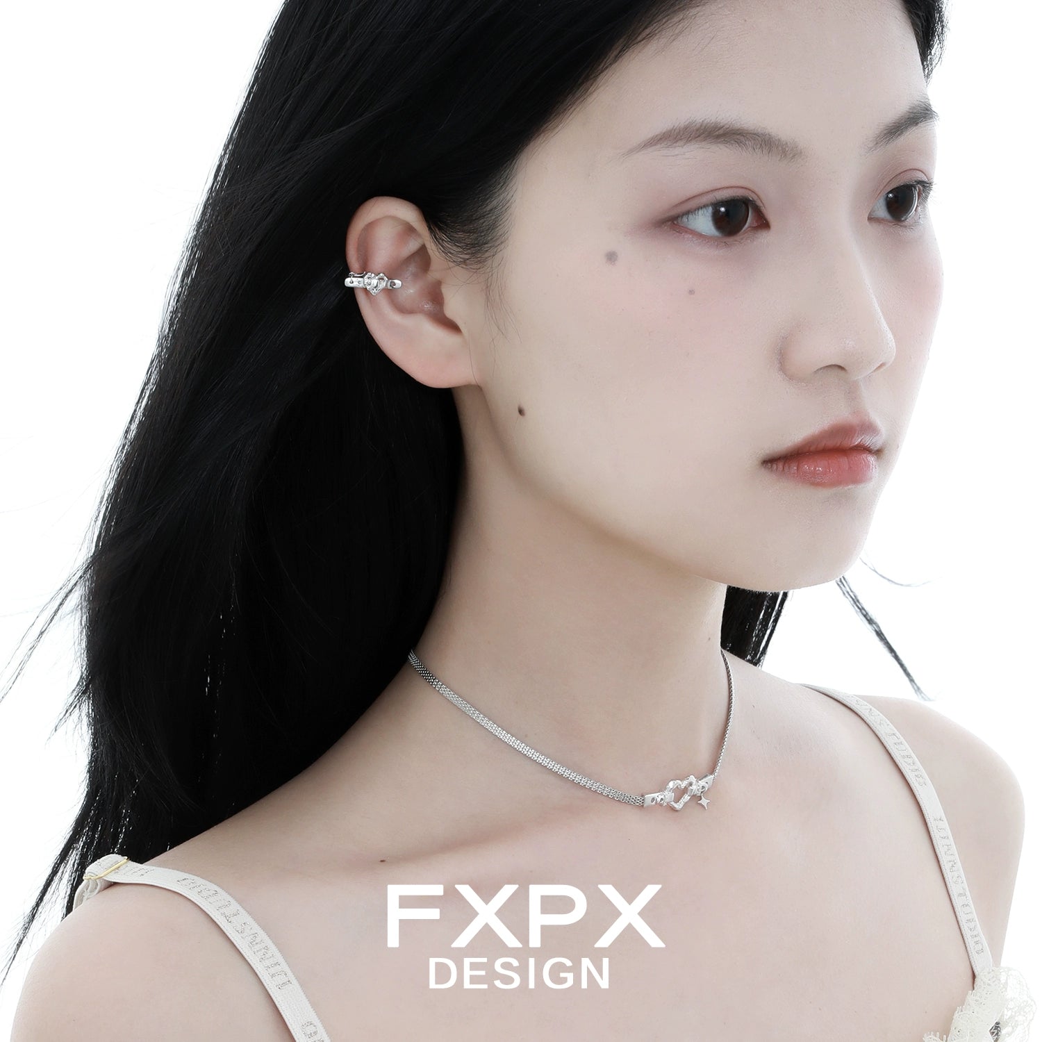 FXPX Y2K star ear cuff worn by a model showcasing a trendy silver accessory