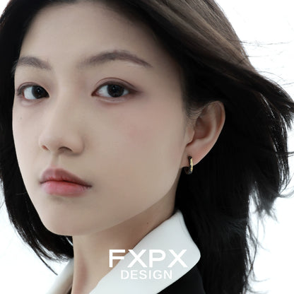 FXPX Y2K vintage earrings worn by a model with flowing hair and minimal makeup