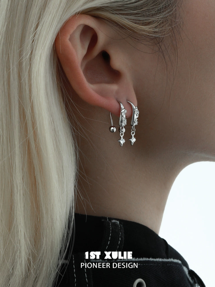 Stylish galactic star earrings with silver accents and dangling star charms for a trendy look