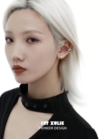 Model wearing 1ST XULIE galactic star geometric earrings for a trendy accessory look
