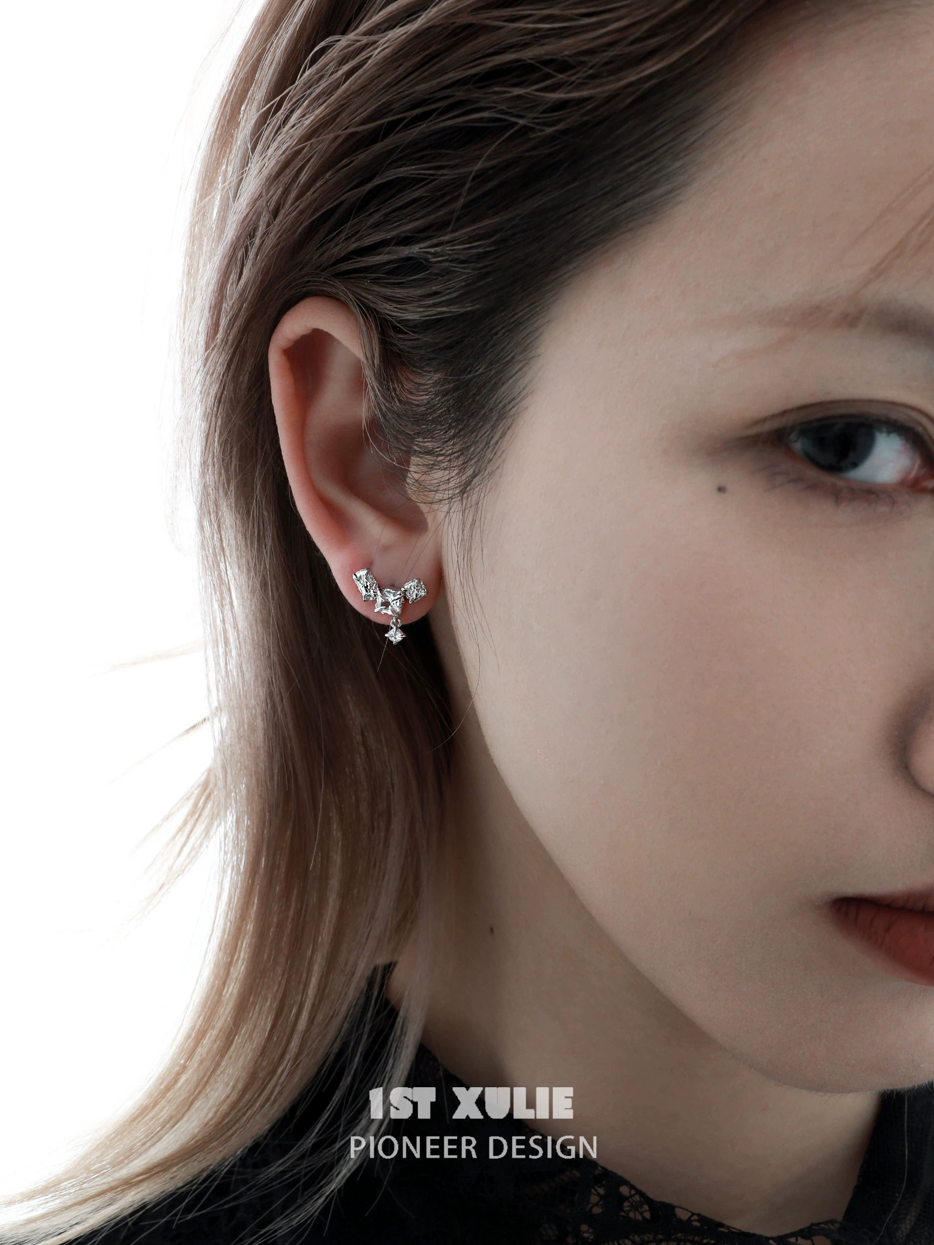 Elegant geometric silver earrings featuring a unique design perfect for contemporary fashion