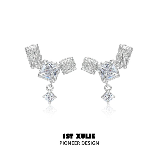 Geometric silver earrings featuring unique shapes and sparkling accents for a modern look