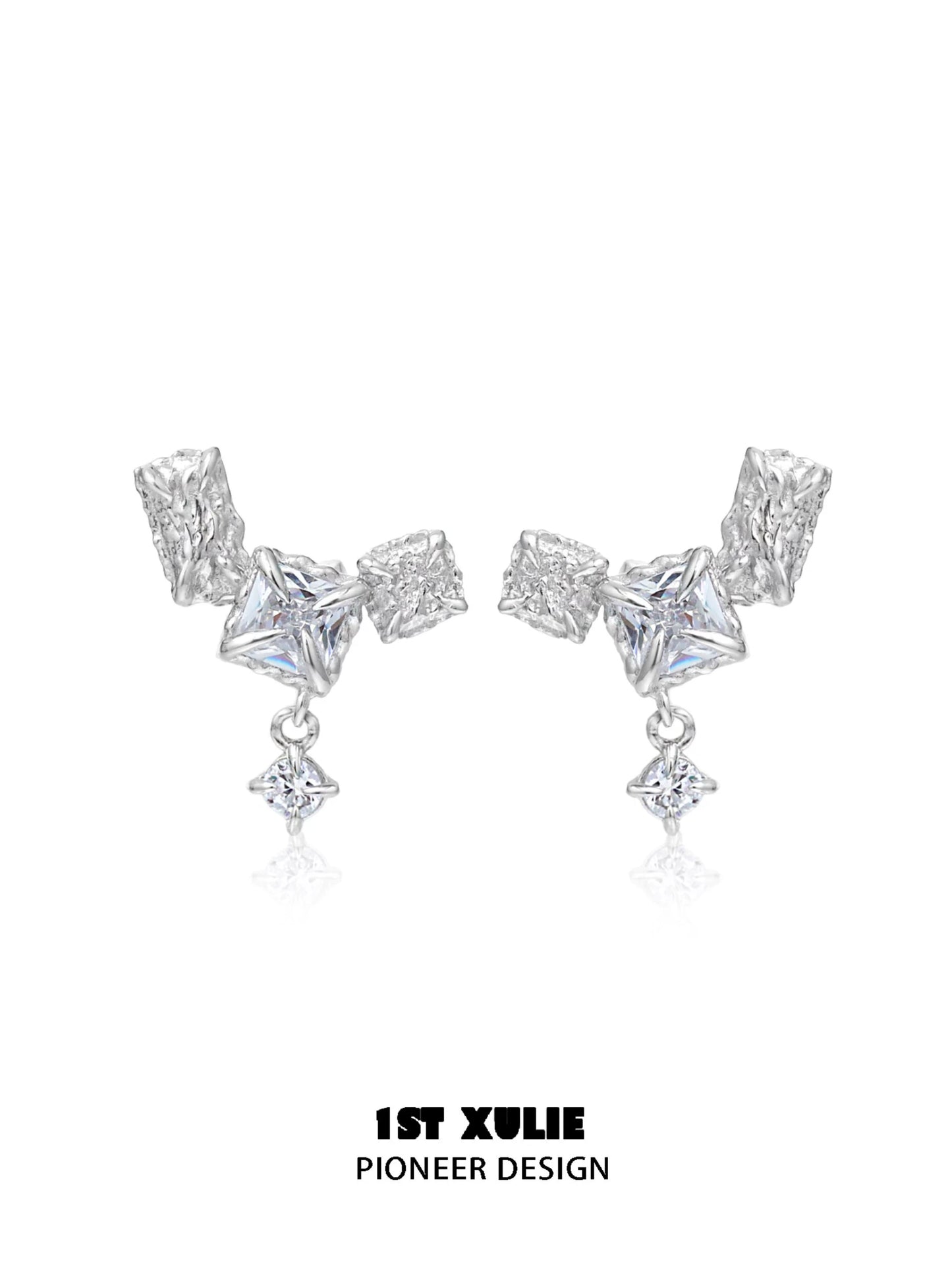 Geometric silver earrings with unique shapes and sparkling details for a modern look