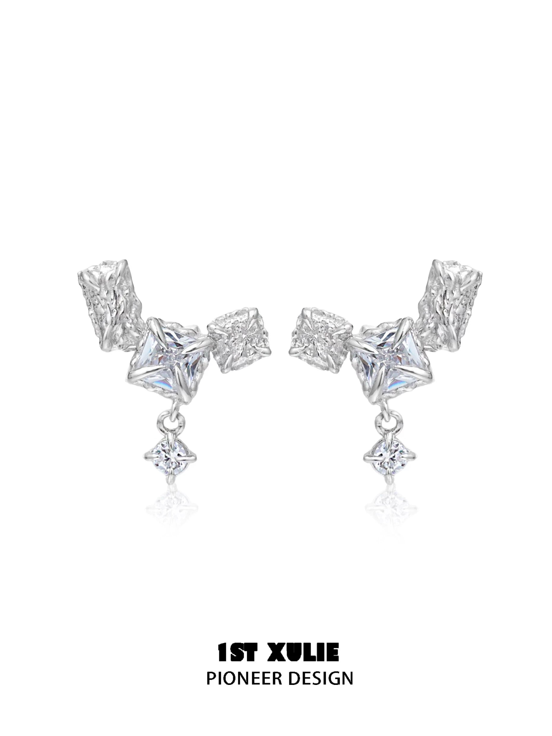 Geometric silver earrings with unique shapes and sparkling details for a modern look