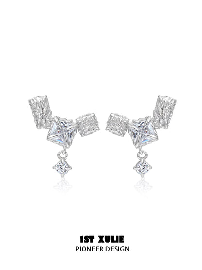 Geometric silver earrings with unique shapes and sparkling details for a modern look