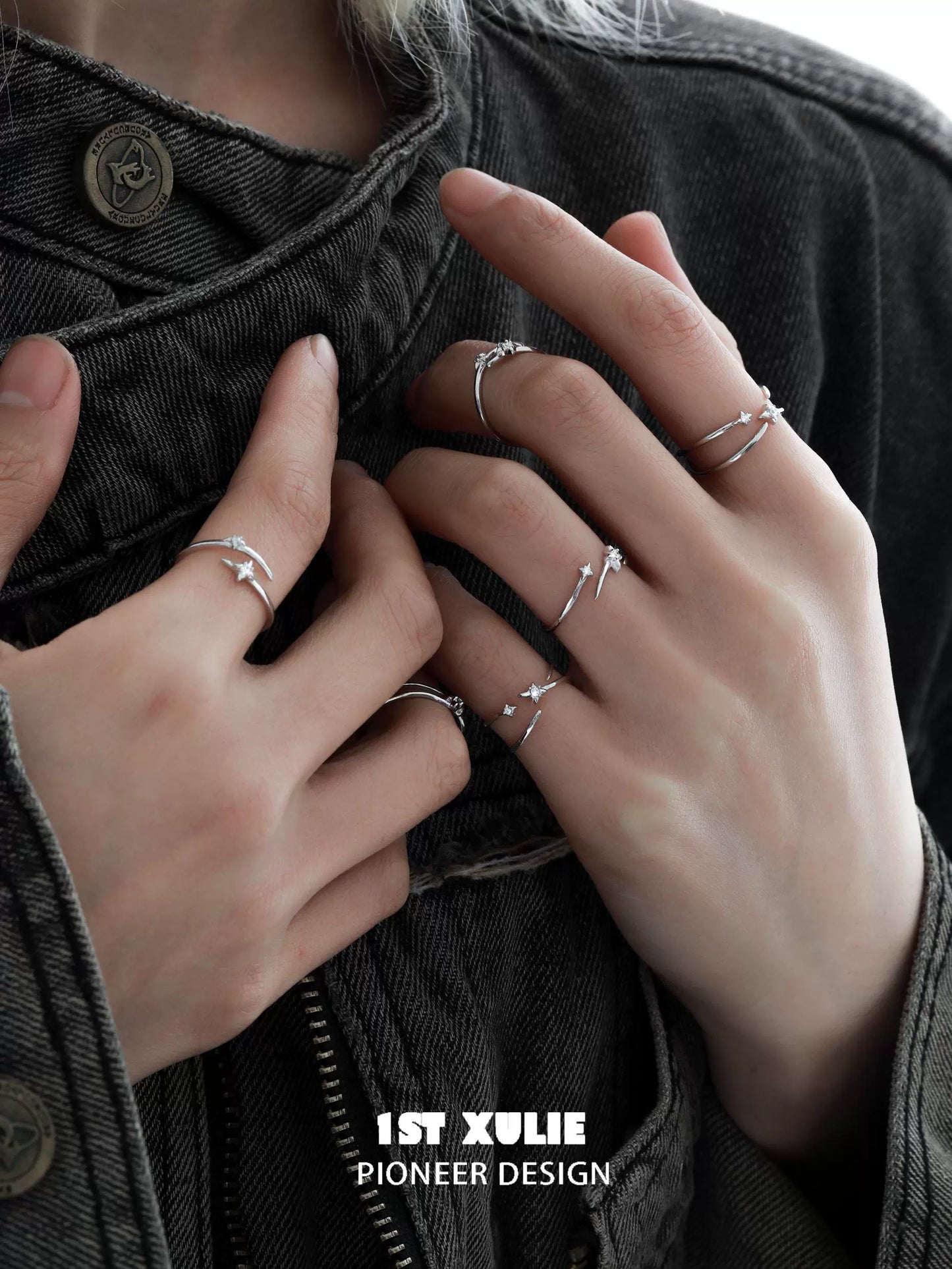 Stylish geometric silver ring worn on multiple fingers for a trendy look by 1ST XULIE