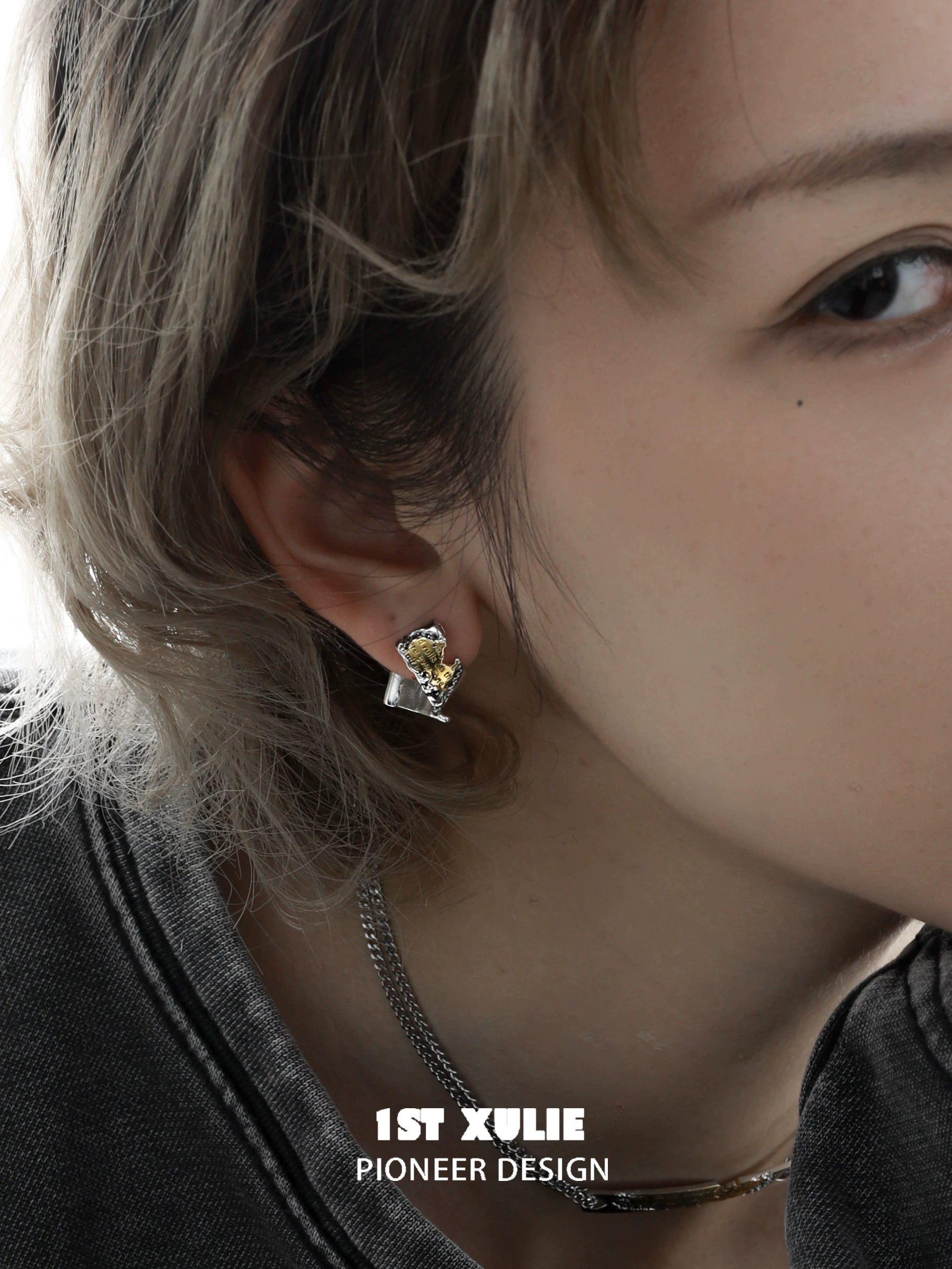 Elegant gold map earrings for women featuring a stylish design with a unique gemstone accent
