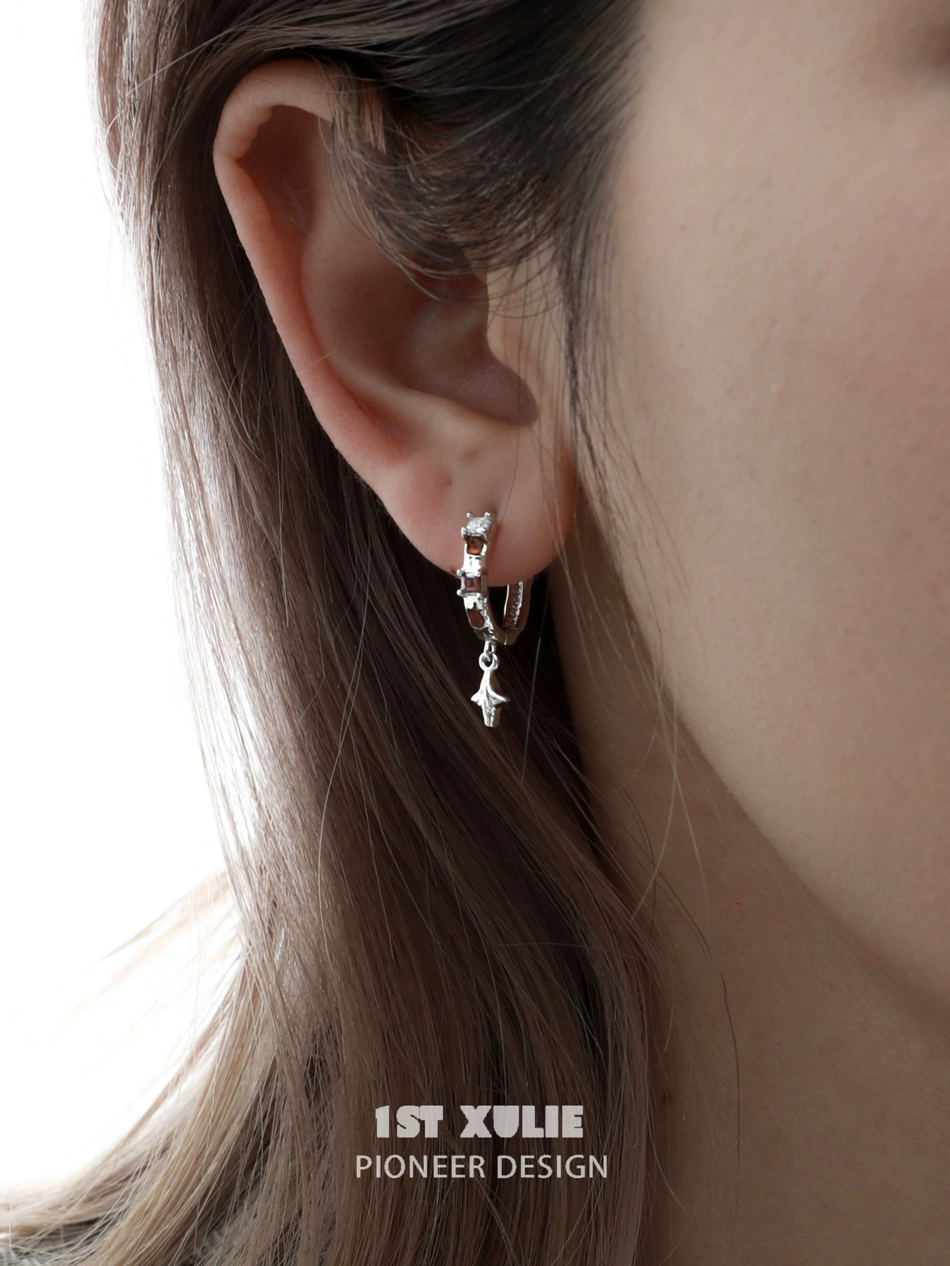 Stylish golden zircon hoop earrings elegantly worn, adding a touch of glam to any outfit