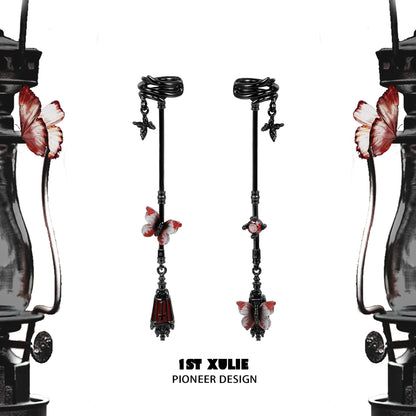 Gothic butterfly earrings with red and black design, featuring intricate detailing and a unique silhouette