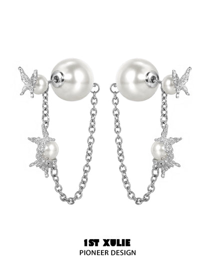 Gothic butterfly earrings featuring silver chains and pearl accents for a stylish look