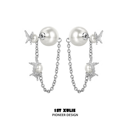 Elegant gothic butterfly earrings with silver chain and pearl accents for a stylish look