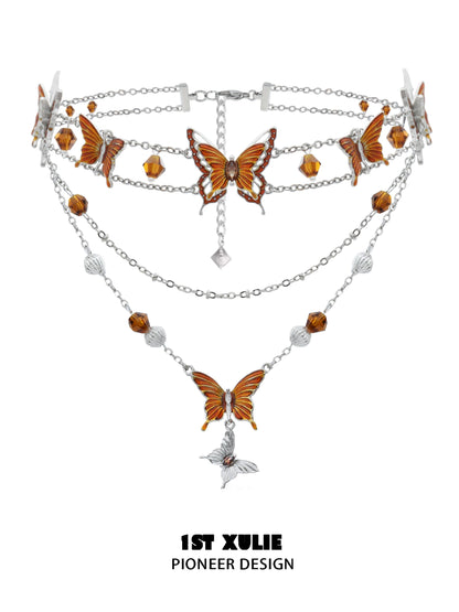 Gothic butterfly necklace with intricate orange butterfly charms and silver chains for a unique look