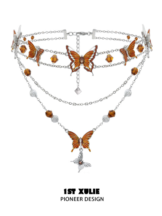 Gothic butterfly necklace with intricate orange butterfly charms and silver chains for a unique look