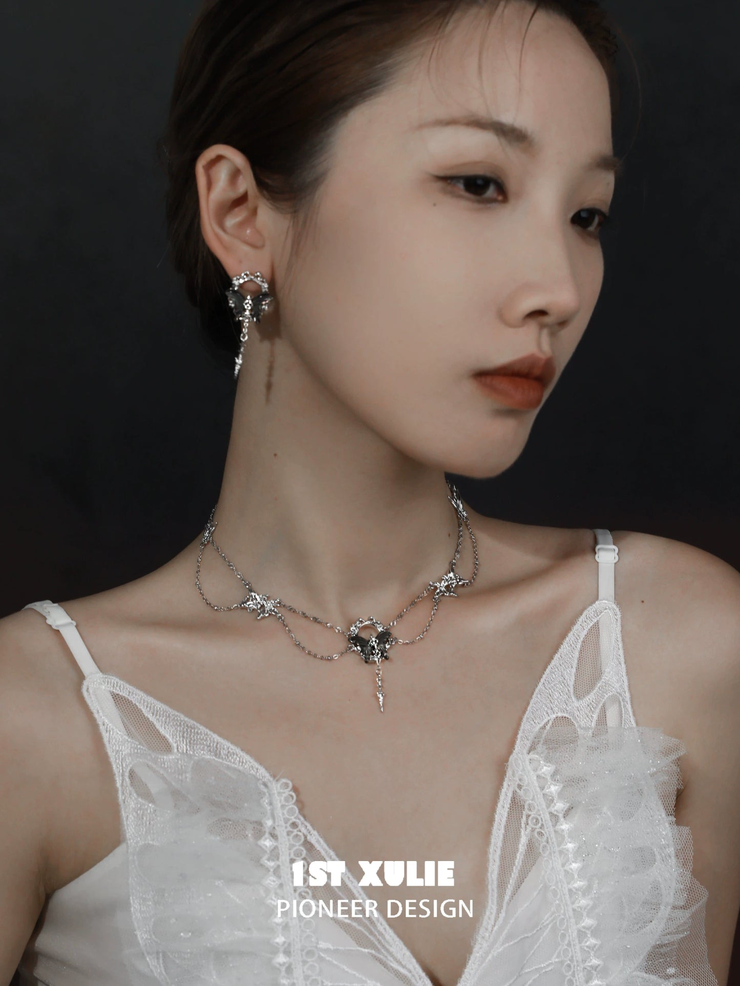 Elegant gothic butterfly necklace featuring intricate silver chains and charm details