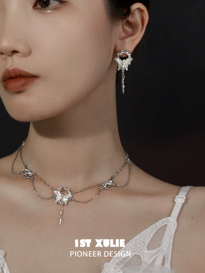 Elegant gothic butterfly necklace with star and chain design, perfect for unique fashion styles