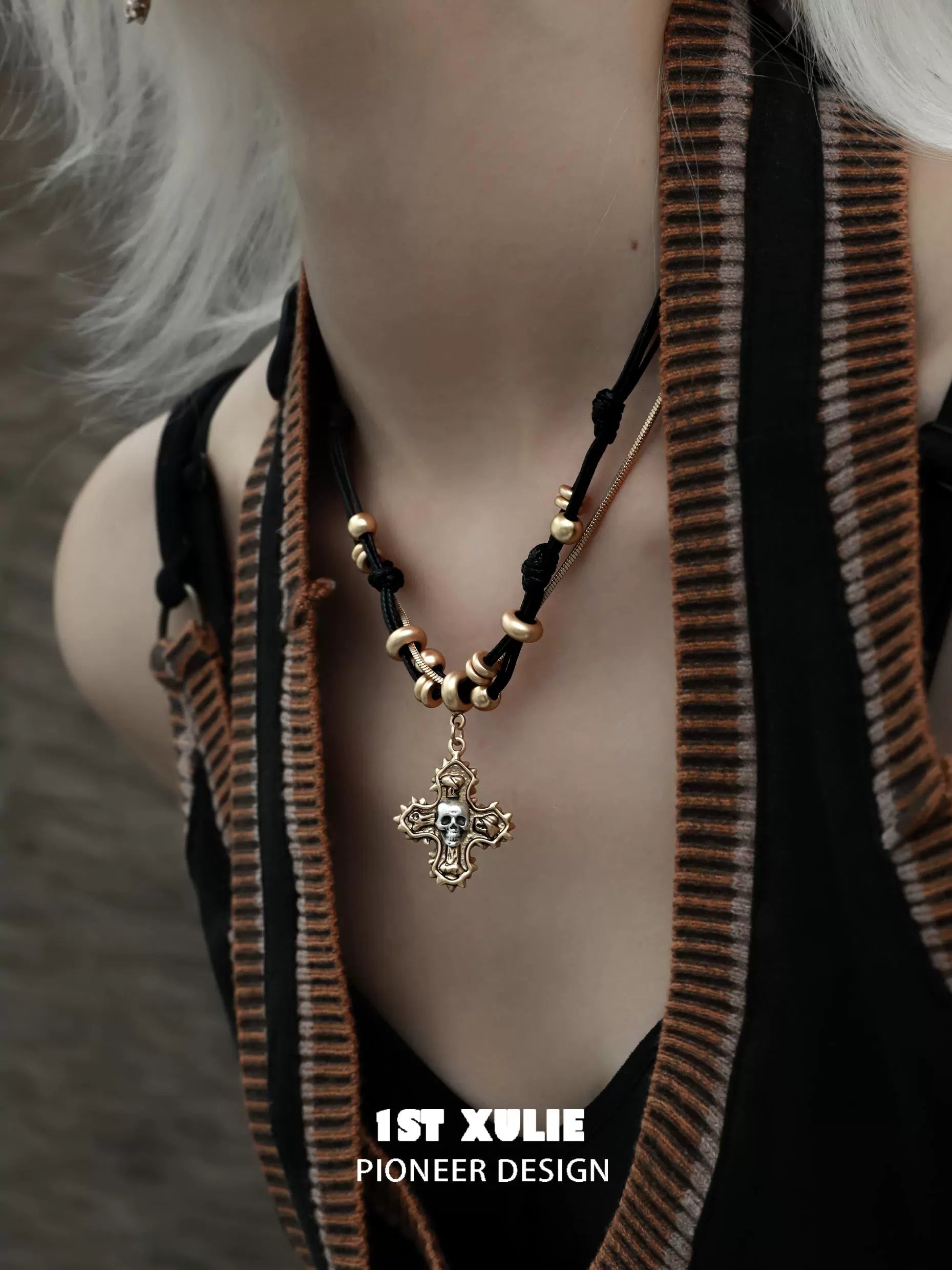 Gothic cross necklace by 1STXULIE featuring a detailed design with beads and adjustable cord