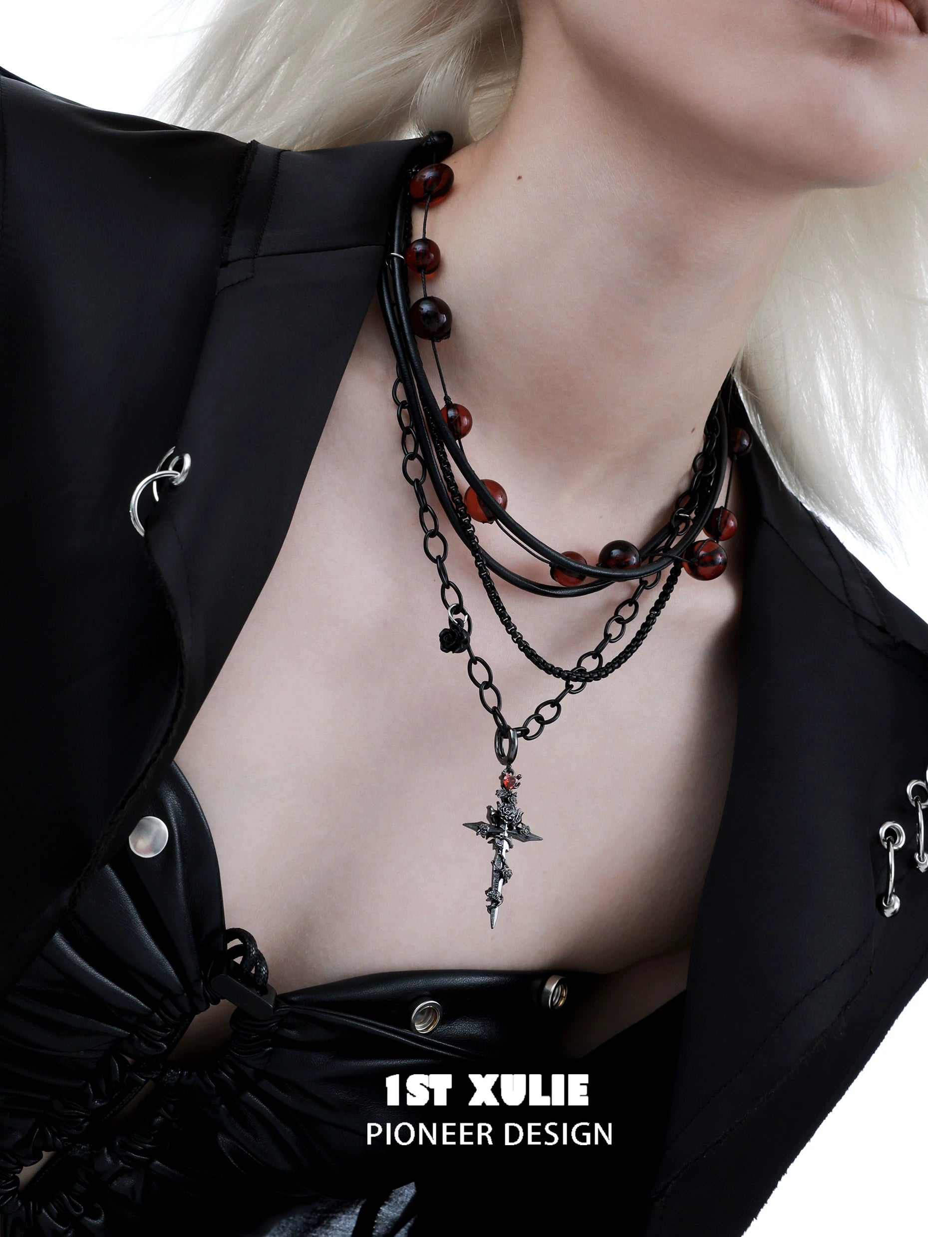 Stylish gothic cross necklace layered with beads for a unique fashion statement