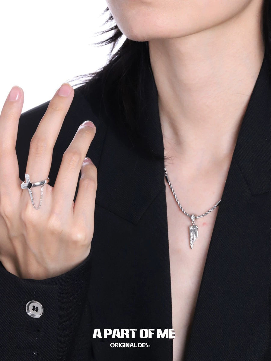 Stunning gothic cross ring for women paired with a stylish silver necklace for a bold look