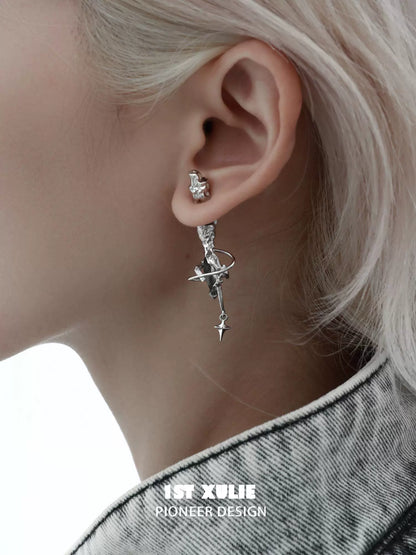 Silver gothic dream core earrings with unique design featuring stars and a crescent moon.