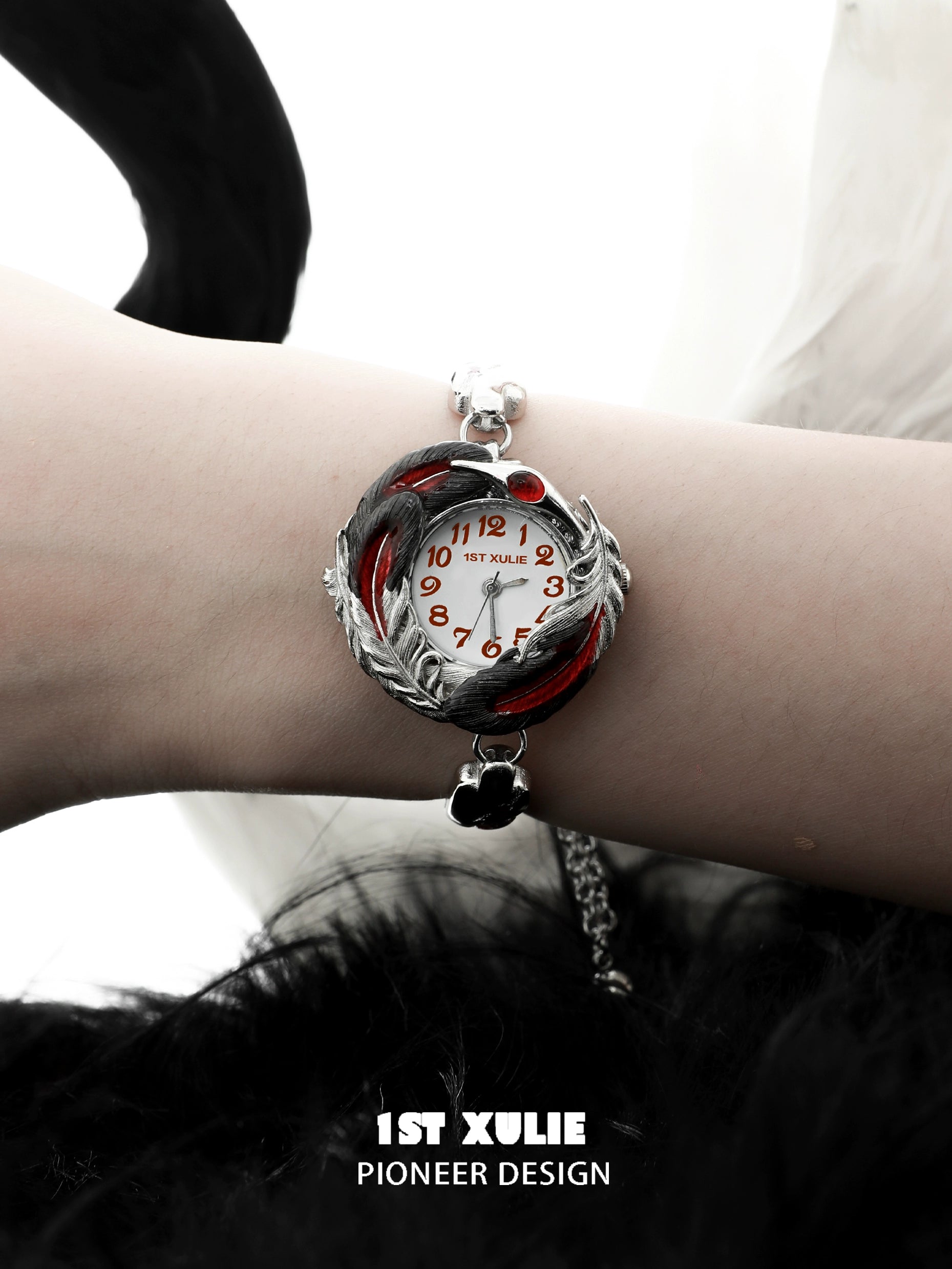 1STXULIE gothic feather bracelet with silver accents and stylish red details