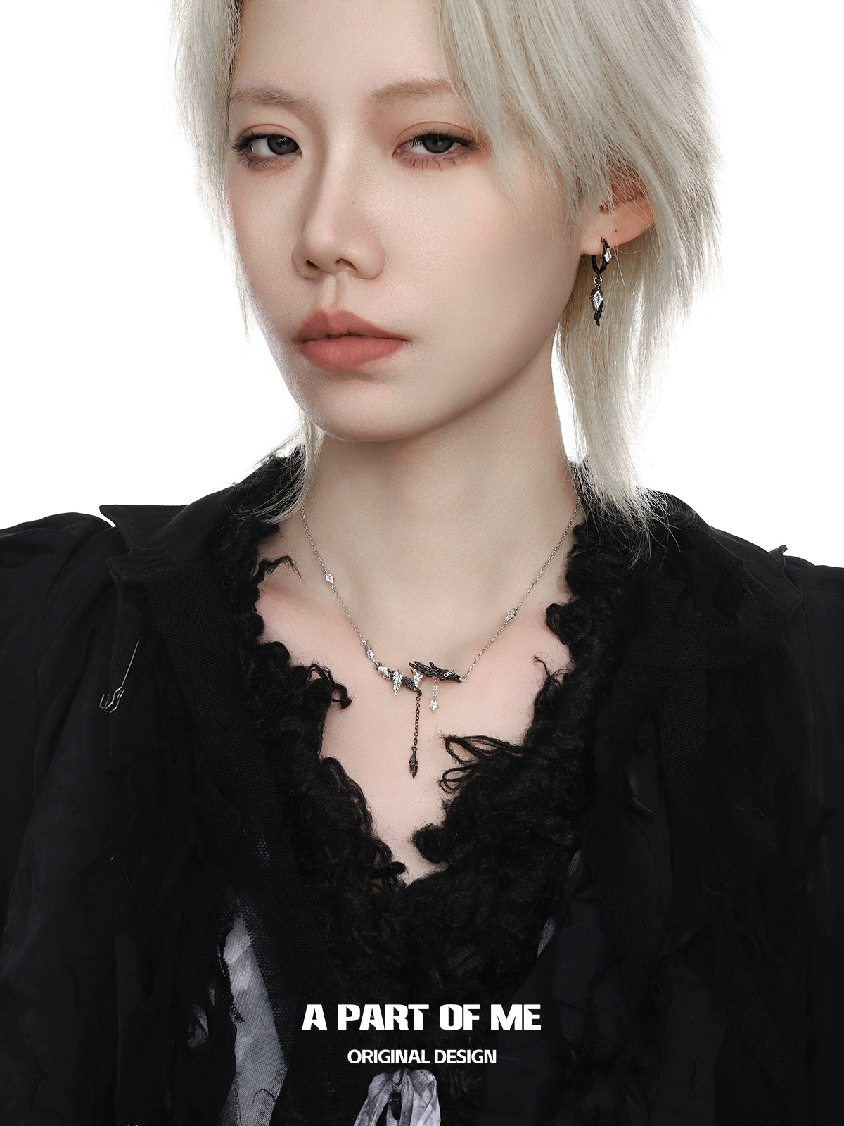 A PART OF ME gothic feather necklace showcased on a model wearing a black outfit
