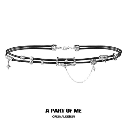 Gothic leather necklace featuring silver charms on a black cord for a unique style
