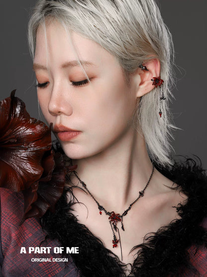 Model wearing a gothic mandala necklace from A PART OF ME featuring intricate design and red accents