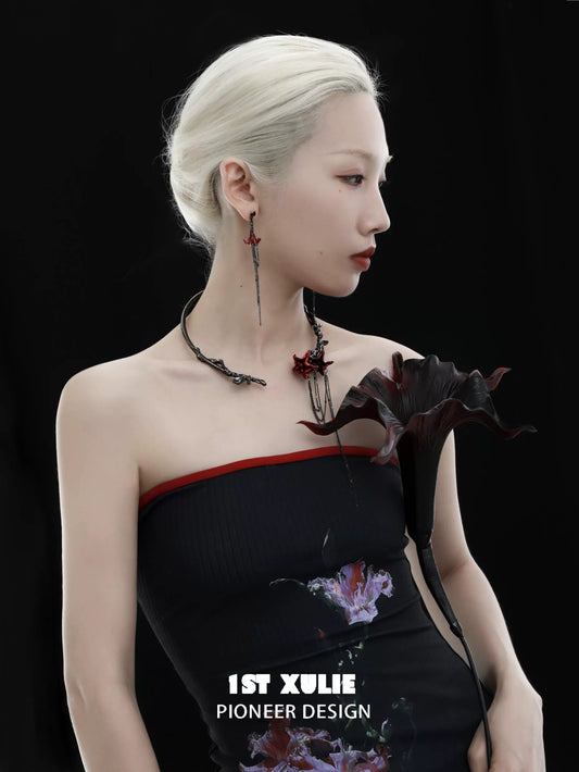 Elegant model showcasing a gothic mandala necklace with intricate design details and a stylish black outfit