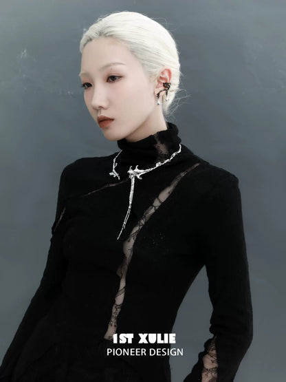 Gothic mandala necklace worn by a model with a sleek hairstyle and dark clothing