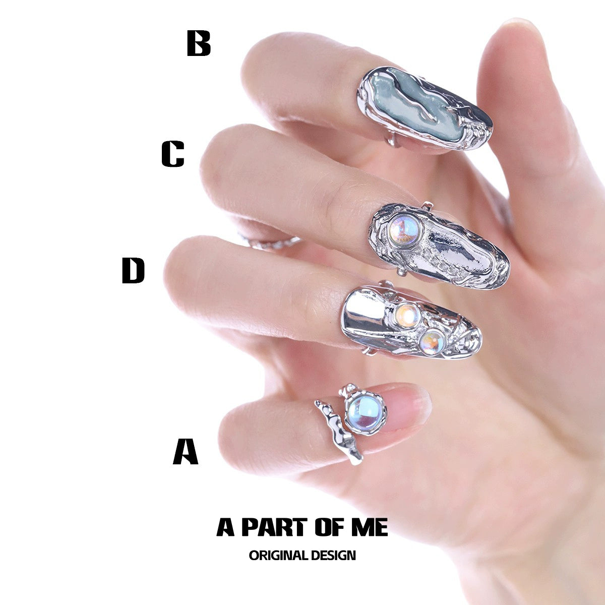 A hand displaying gothic nail rings for women designed by A PART OF ME in various styles