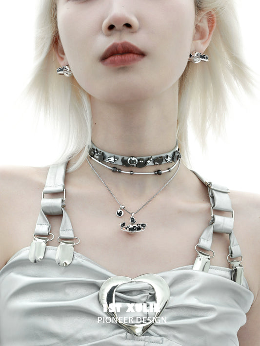 Stylish model wearing a gothic night owl cat necklace with matching earrings and a unique choker